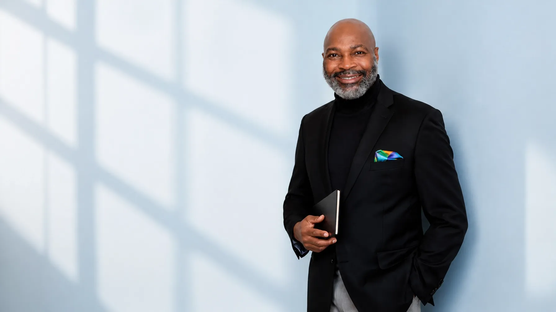 Leadership coach standing in a bright studio